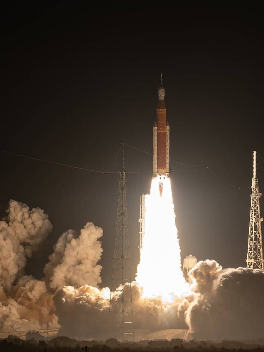 Artemis I lifts off at night from Kennedy Space Center.