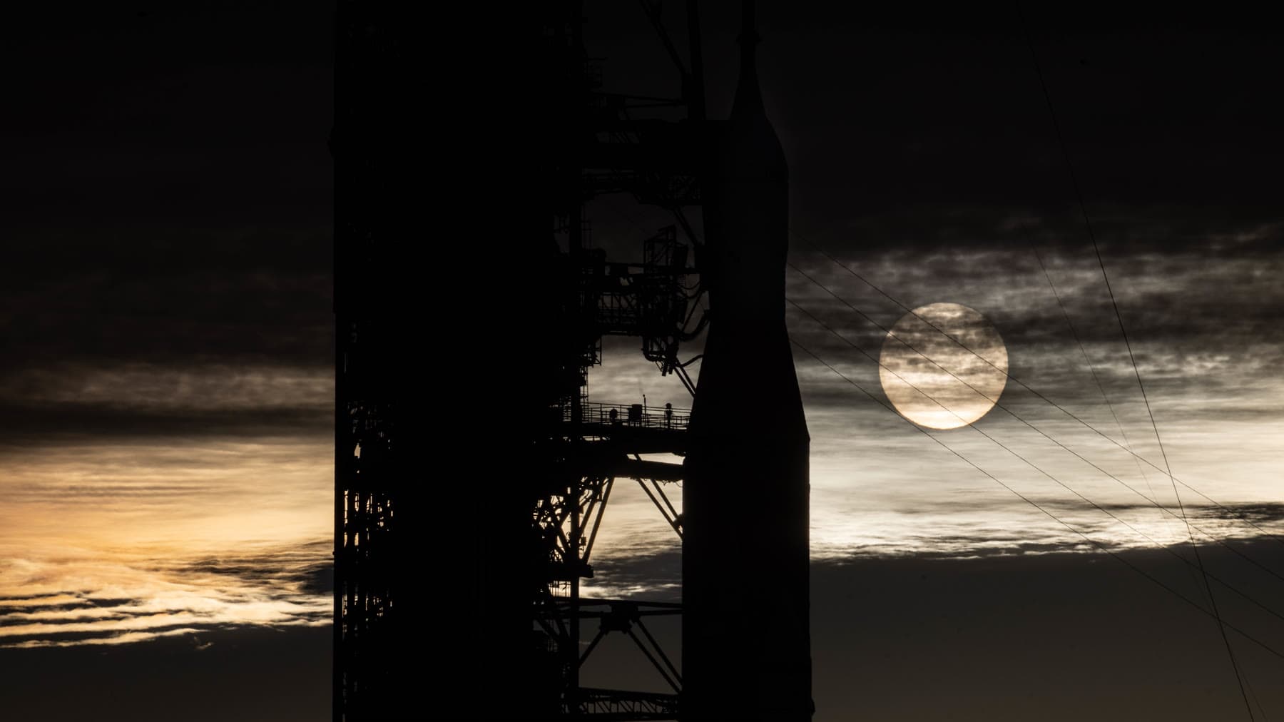 Artemis II hardware and launch infrastructure at sunrise.